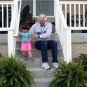 Julia on the back steps with P-Paw